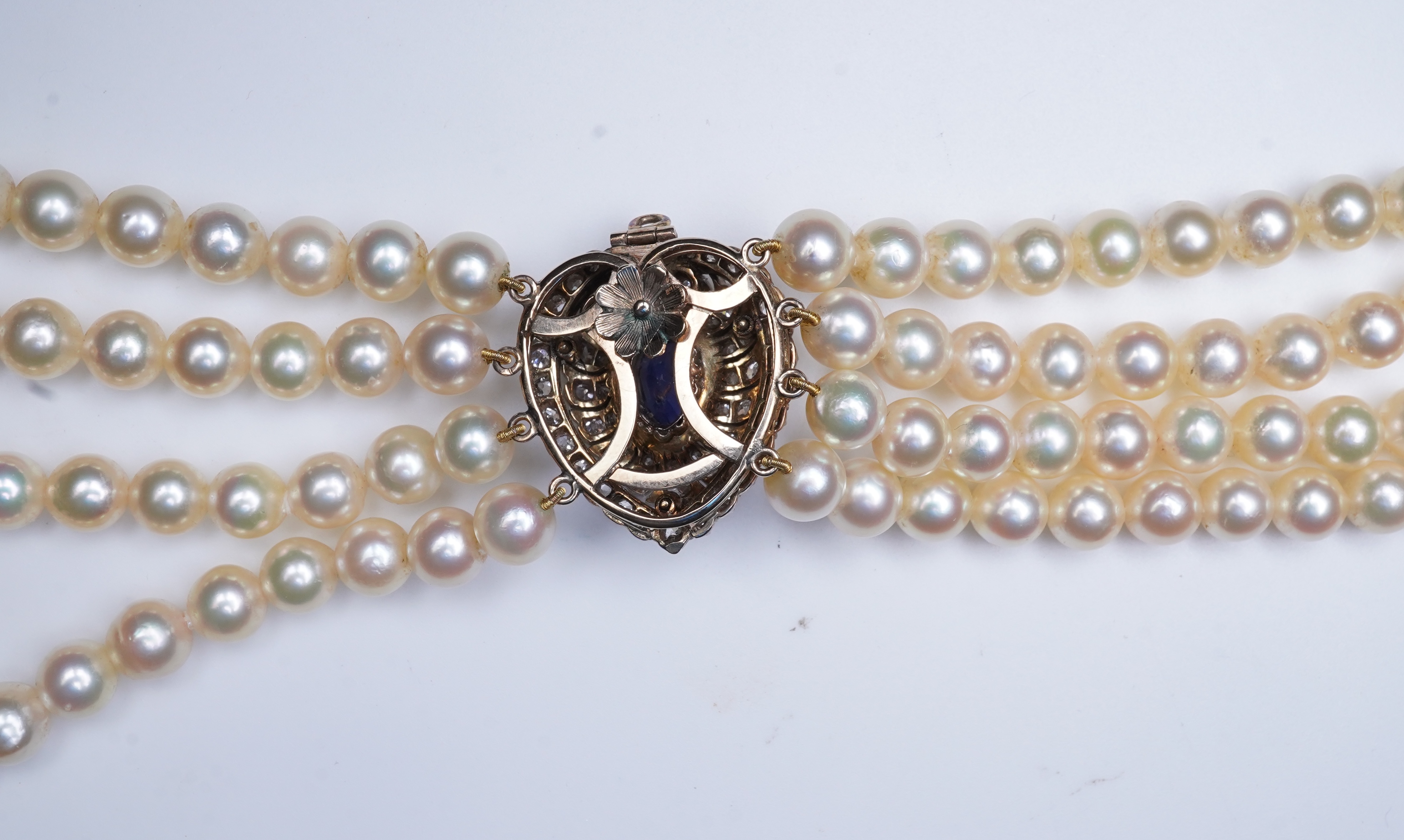 A late Victorian sapphire and diamond brooch and cultured pearl necklace, circa 1900 and later